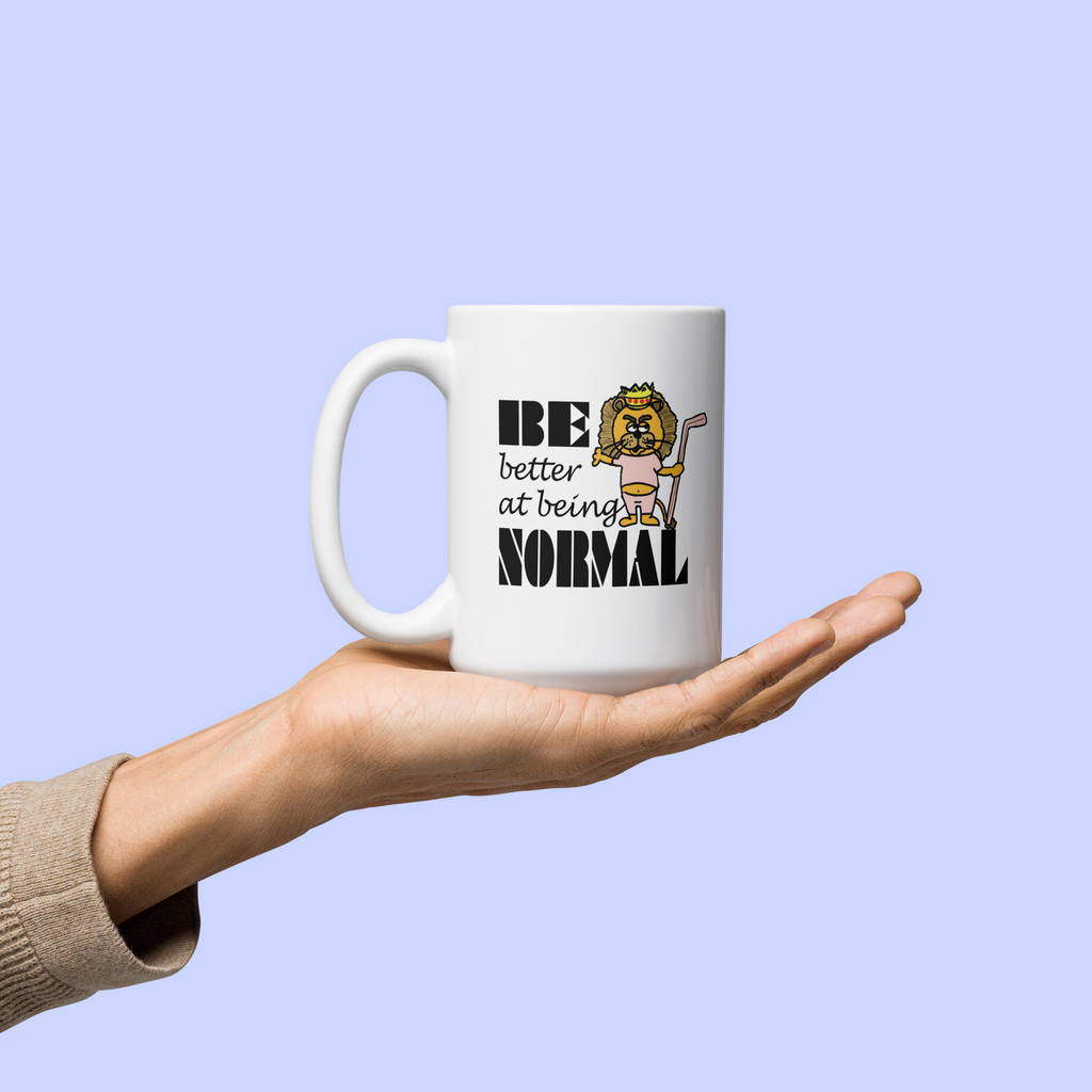 "Be Better at Being Normal" Lion Mug | Sock Puppet Master